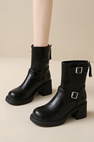 Black faux leather ankle boots with stylish metal buckle and low heel  