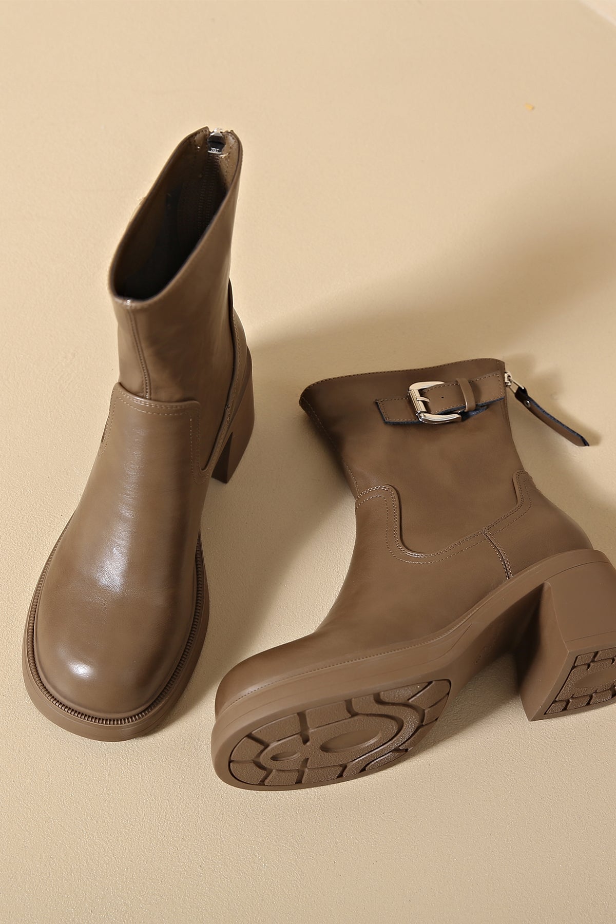 Light brown faux leather low heel boots for a trendy touch 