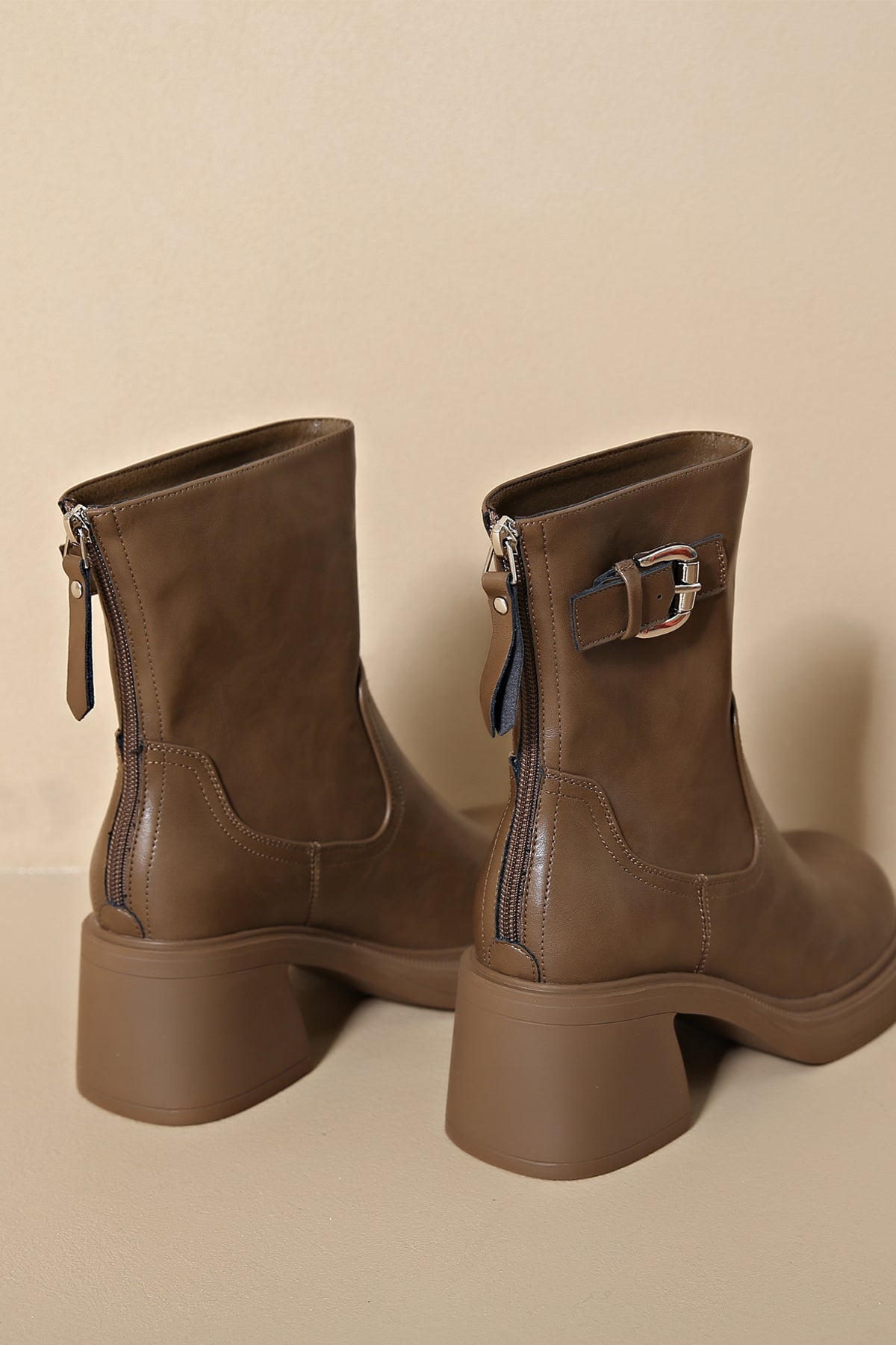 Light brown faux leather low heel boots with a timeless look 