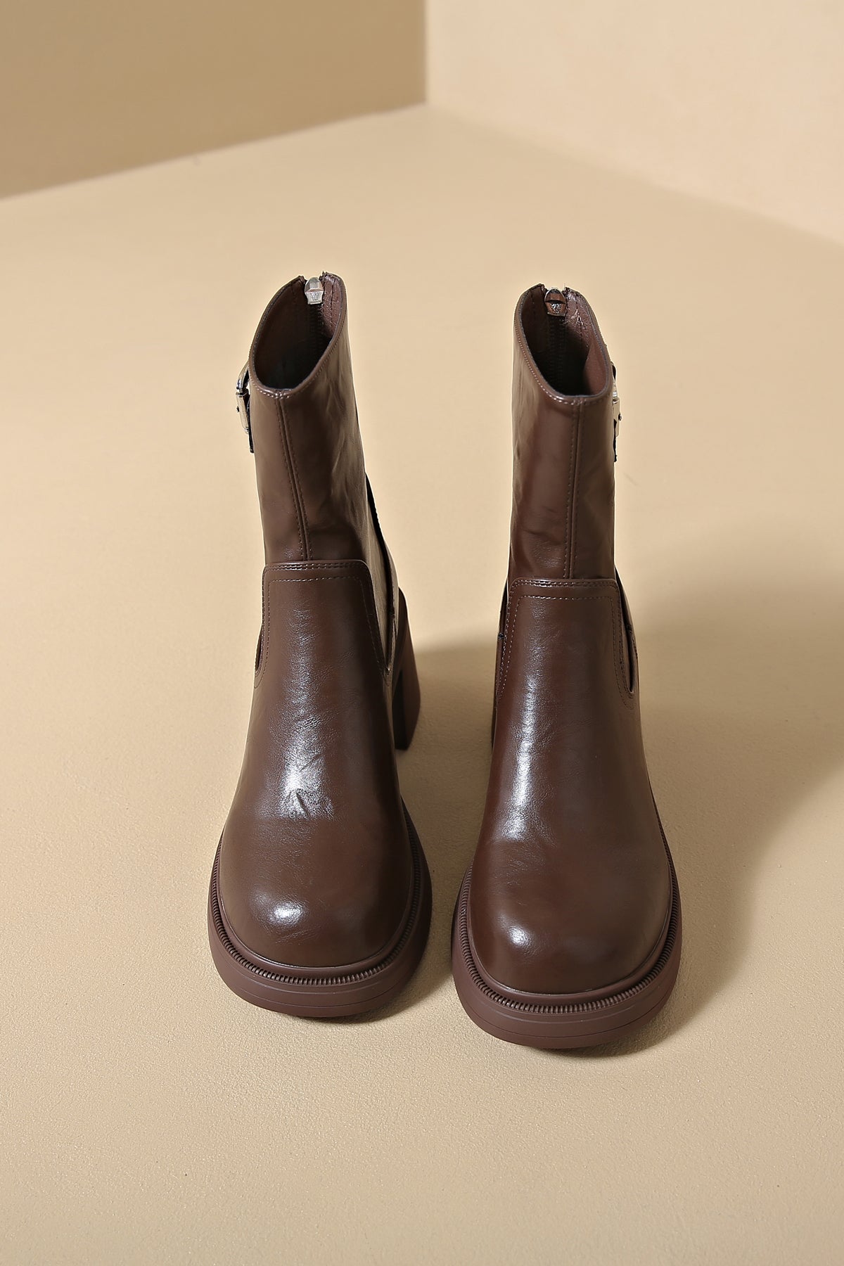 Sophisticated brown faux leather low heel boots for work or play