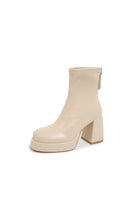 White Leather Ankle Boots with Chunky Platforms for a Bold Step